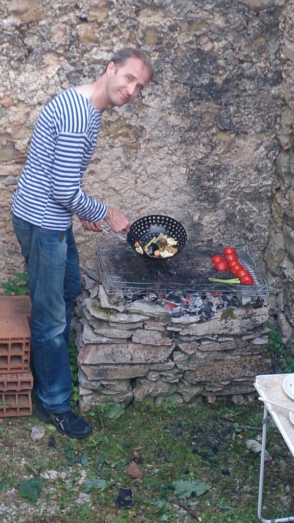 Jonathan barbecuing. Look at all the tomatoes!