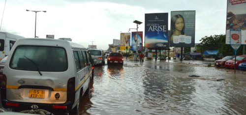 Back in Accra, the rainy season brings flooding and chaos to the streets.